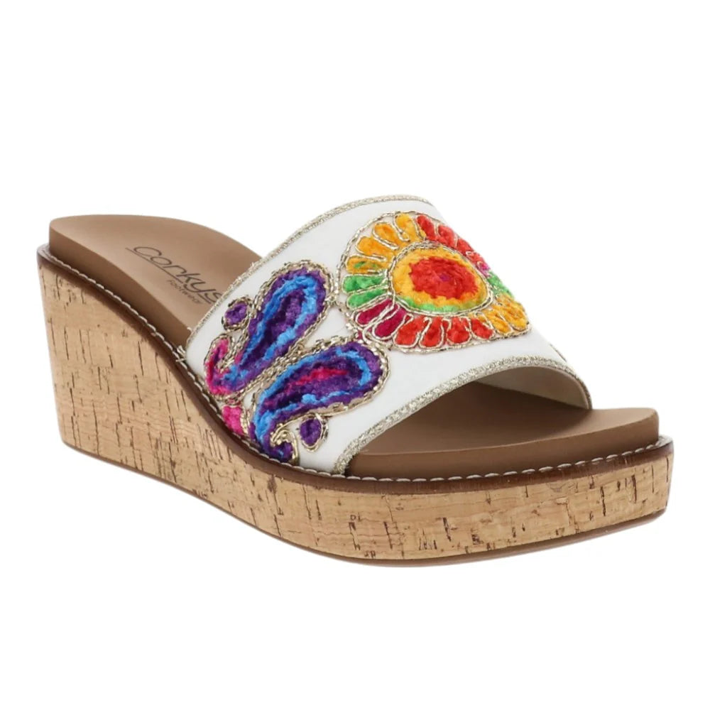 Colorful sandal with a cork wedge sole on a white background