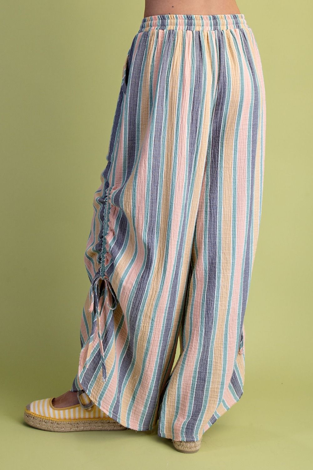 Multicolored striped pants on a green background