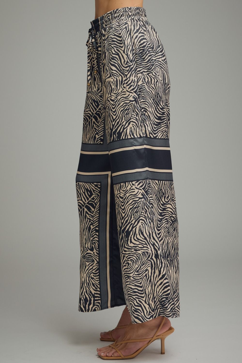 Zebra print pants with a gray background