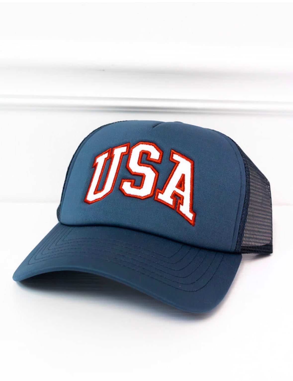 Blue cap with 'USA' text on a white background