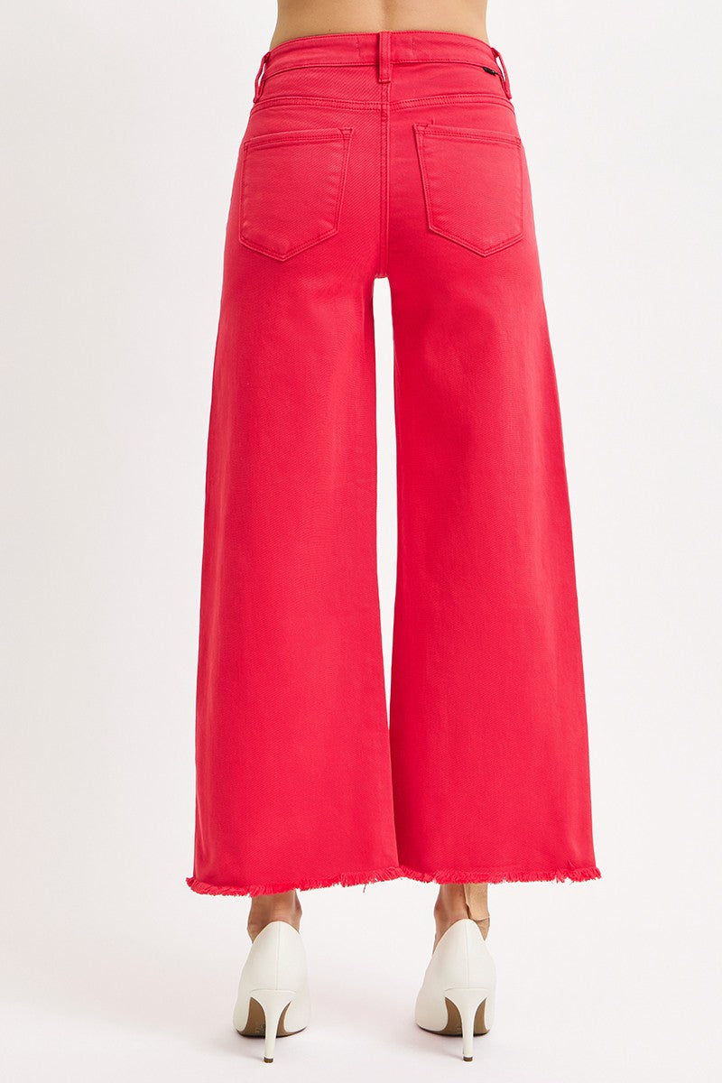 Red wide-leg jeans on a white background