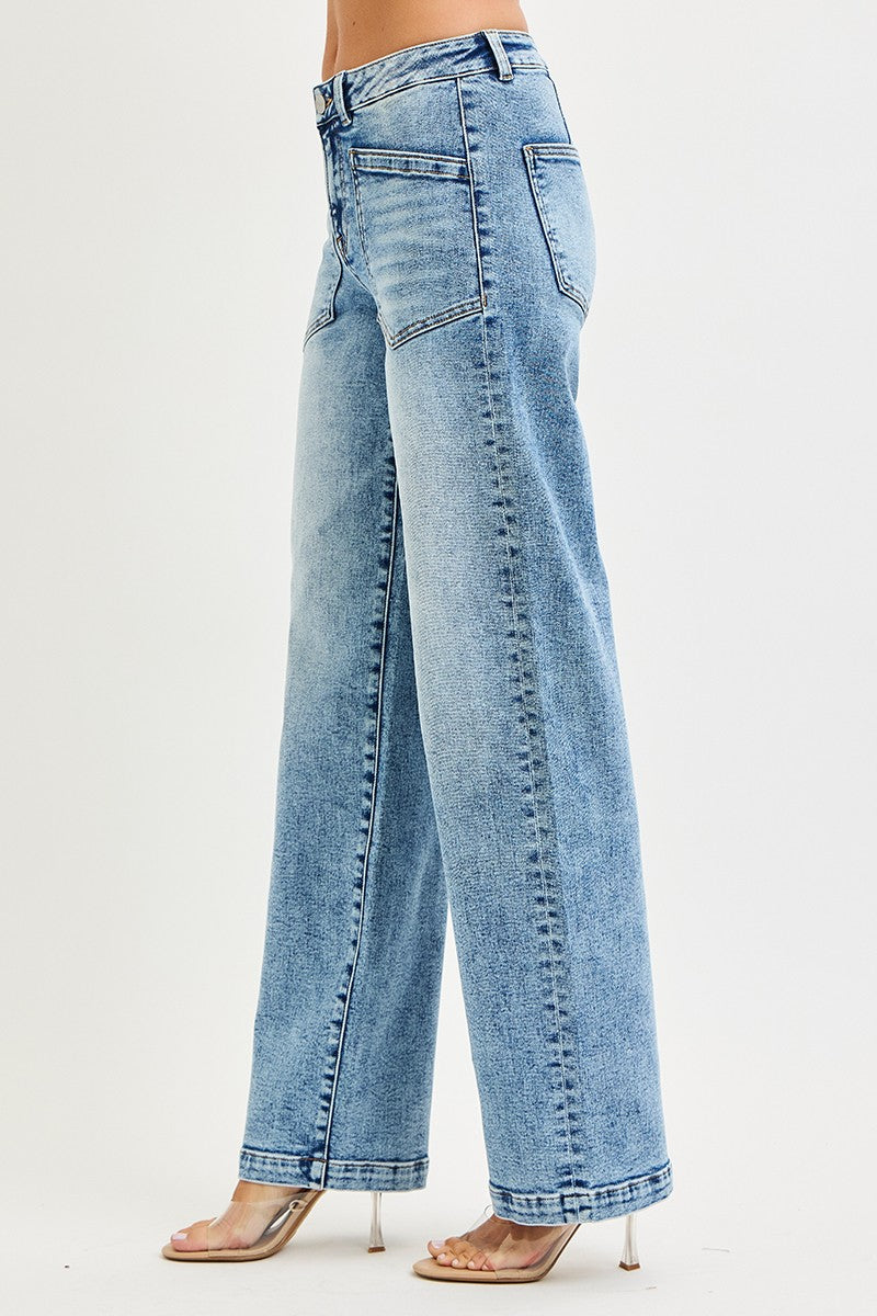 Light blue jeans worn by a person on a white background