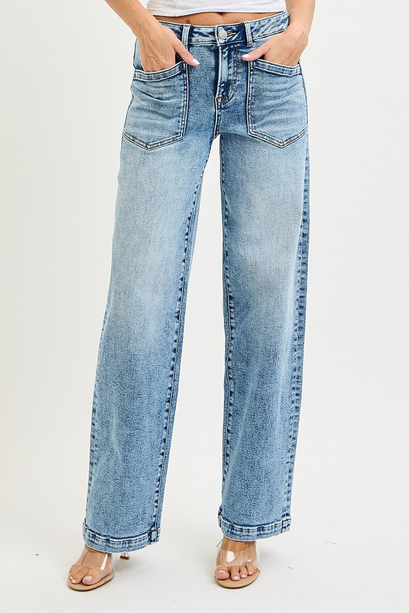 Light blue jeans worn by a person on a white background