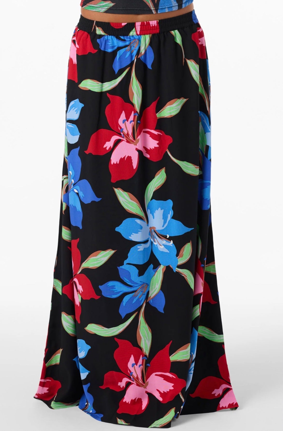 Floral-patterned skirt with red, blue, and green flowers on a black background
