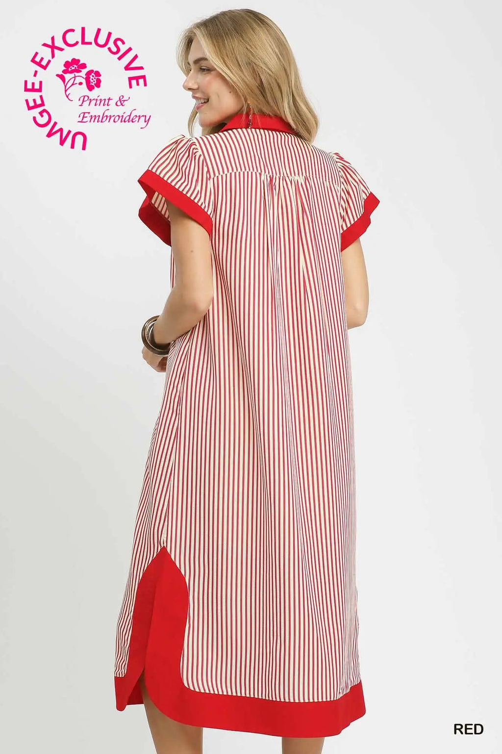 Woman wearing a red and white striped dress with 'UMgee Exclusive' branding.