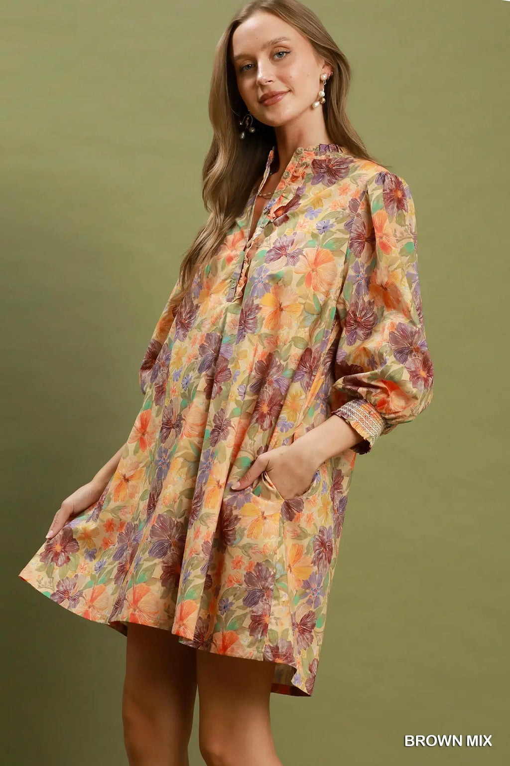 Woman wearing a floral dress with a brown background