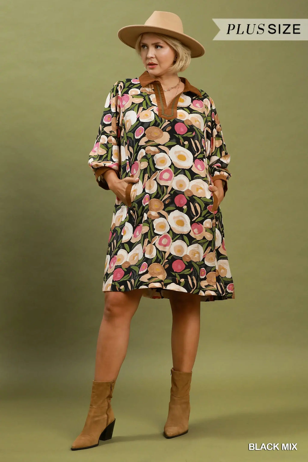 Woman wearing a floral dress with a hat on a green background
