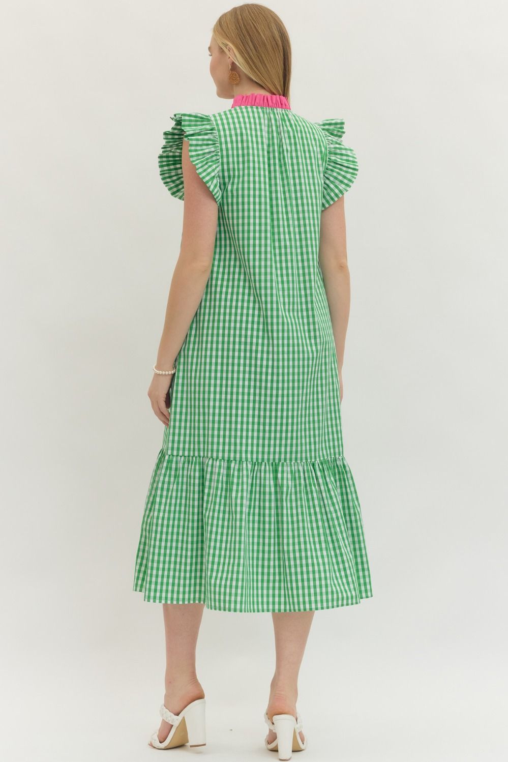 Green checkered dress with ruffled sleeves on a white background