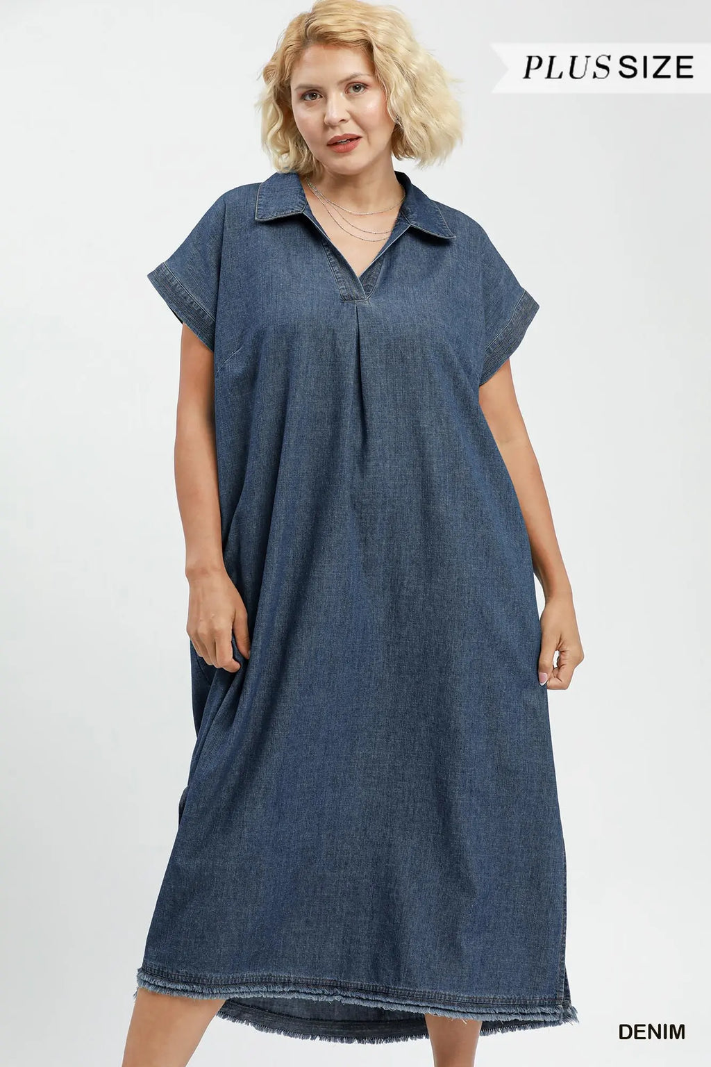 Woman wearing a denim dress on a white background with 'Plus Size' text.