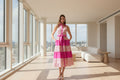 woman wearing tiered dress in penthouse