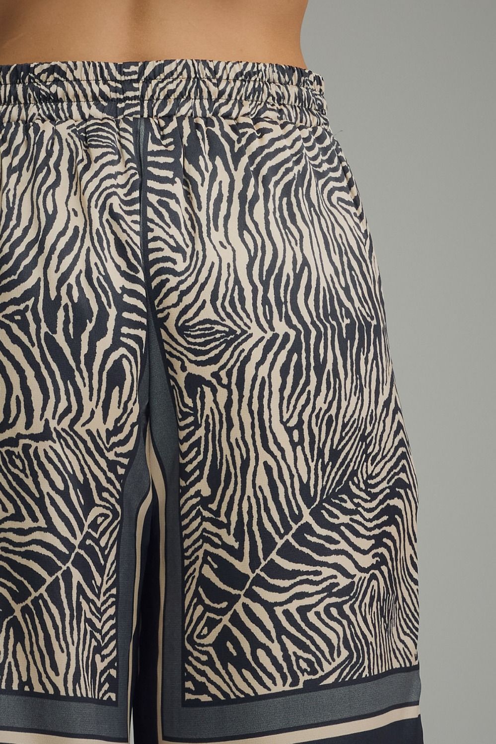Zebra patterned shorts on a gray background
