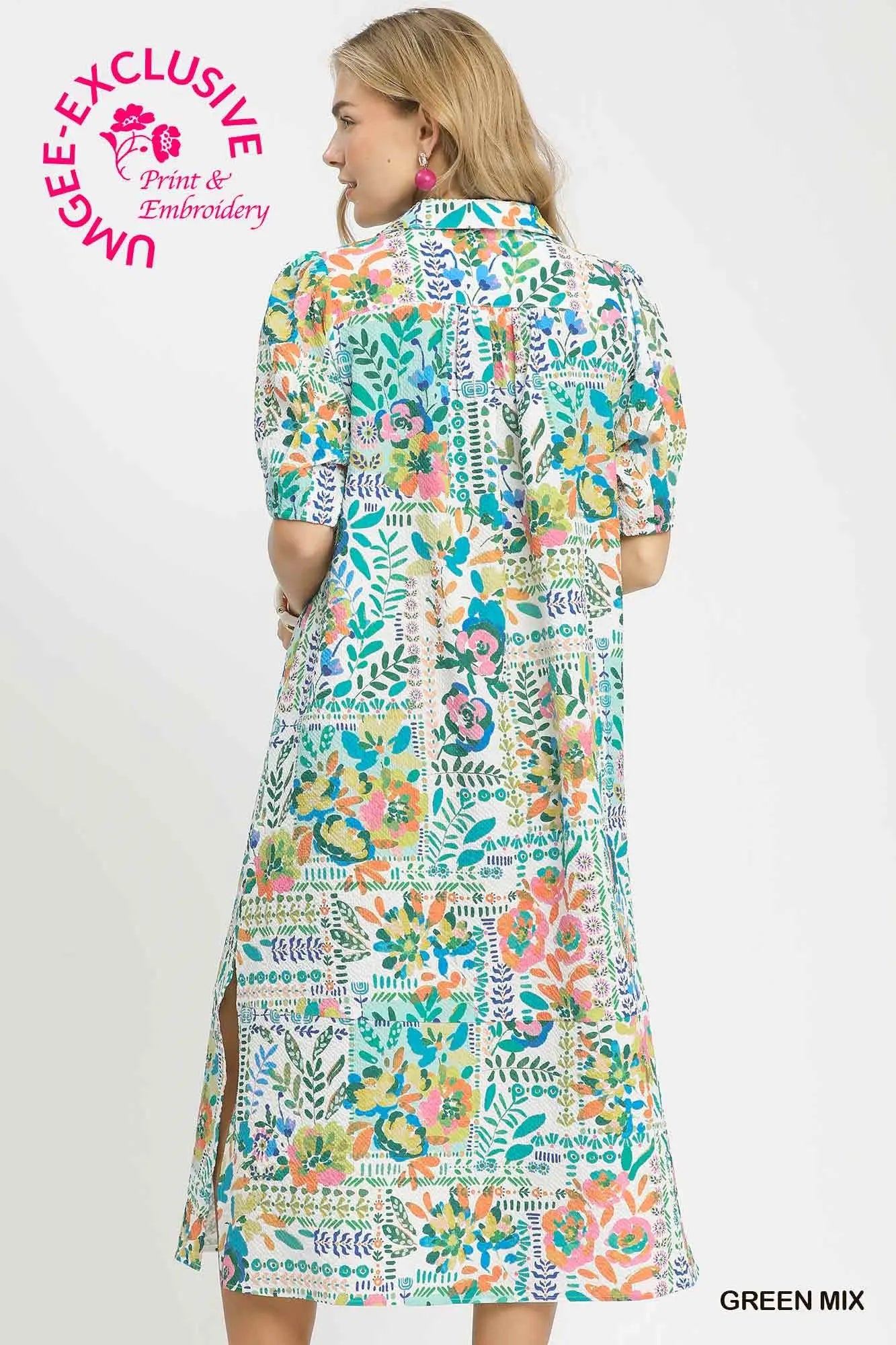 Woman wearing a colorful floral dress with 'UMEE Exclusive' branding on a white background