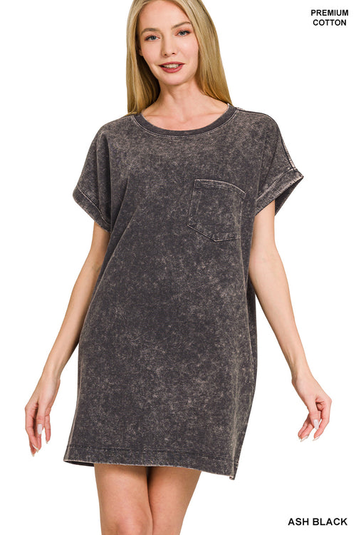 Woman wearing an ash black t-shirt dress on a white background