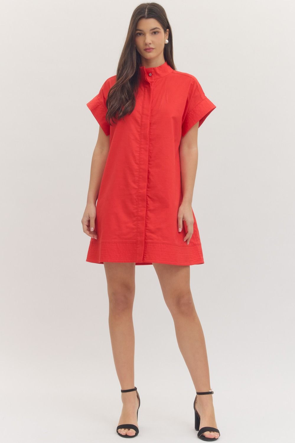 Woman wearing a red dress on a white background