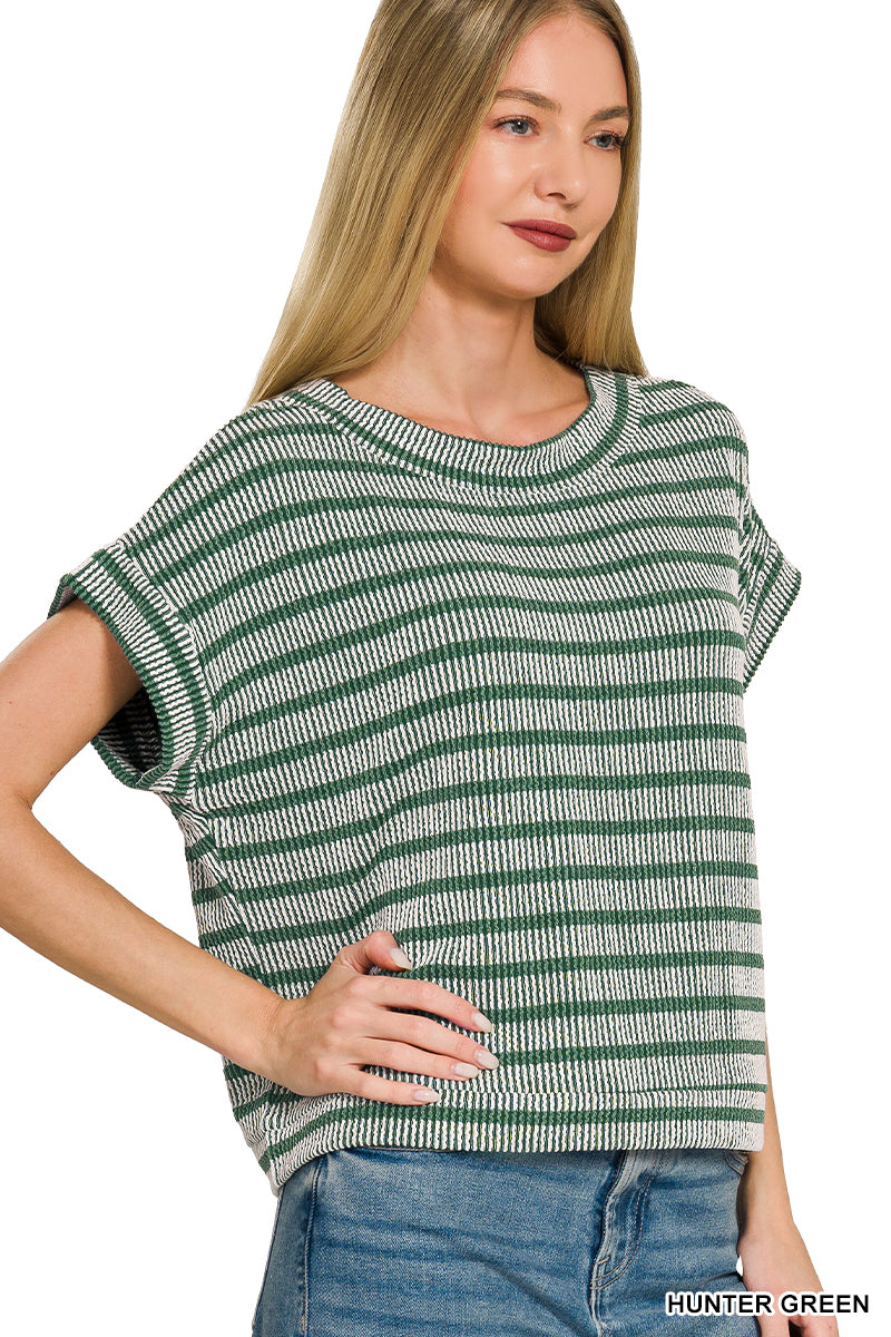 Woman wearing a green and white striped shirt with text 'HUNTER GREEN' at the bottom.