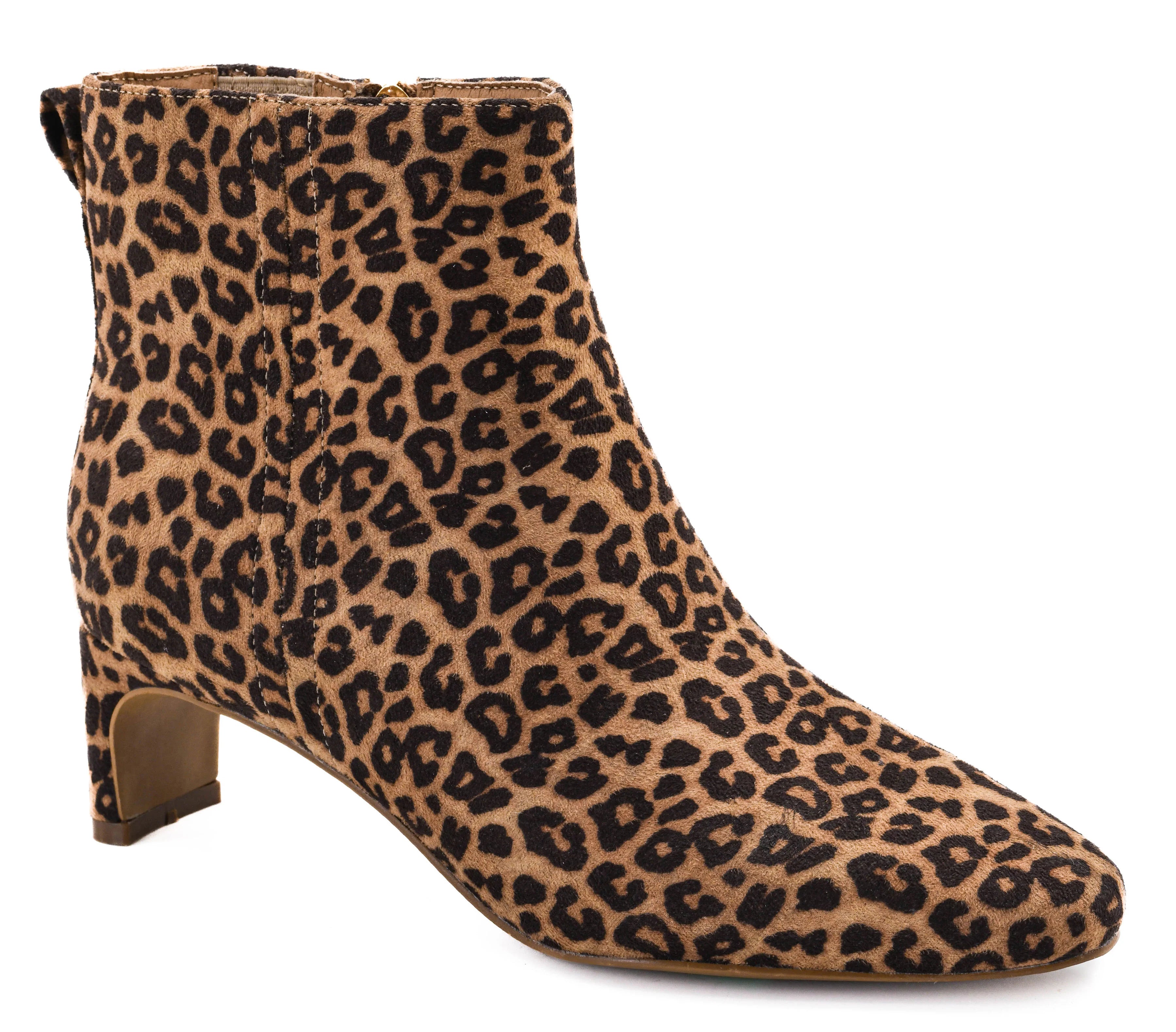 A single ankle boot with a tan and black leopard print pattern, featuring a low block heel and a pointed toe, shown against a plain white background.