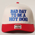 Cap with 'Bad Day to Be a Hot Dog' text on a plain background