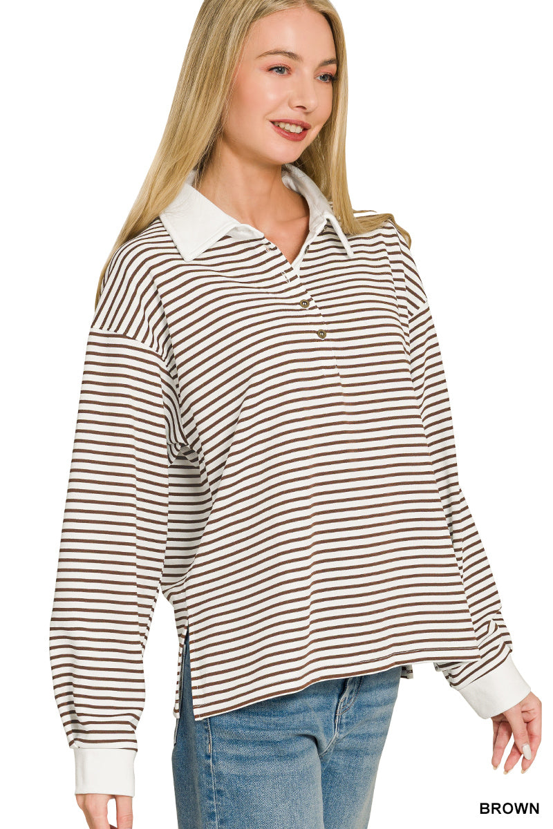 A woman modeling a long-sleeve collared knit top with horizontal brown and cream stripes, paired with blue jeans, against a plain white background.