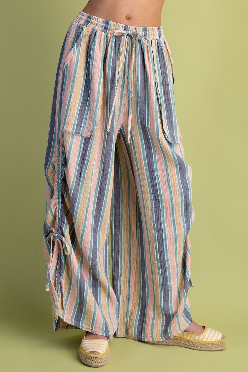 Multicolored striped pants on a green background
