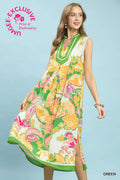 Woman wearing a colorful floral dress with 'UMEE Exclusive' branding on a light blue background.