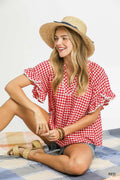 woman wearing red checkered top