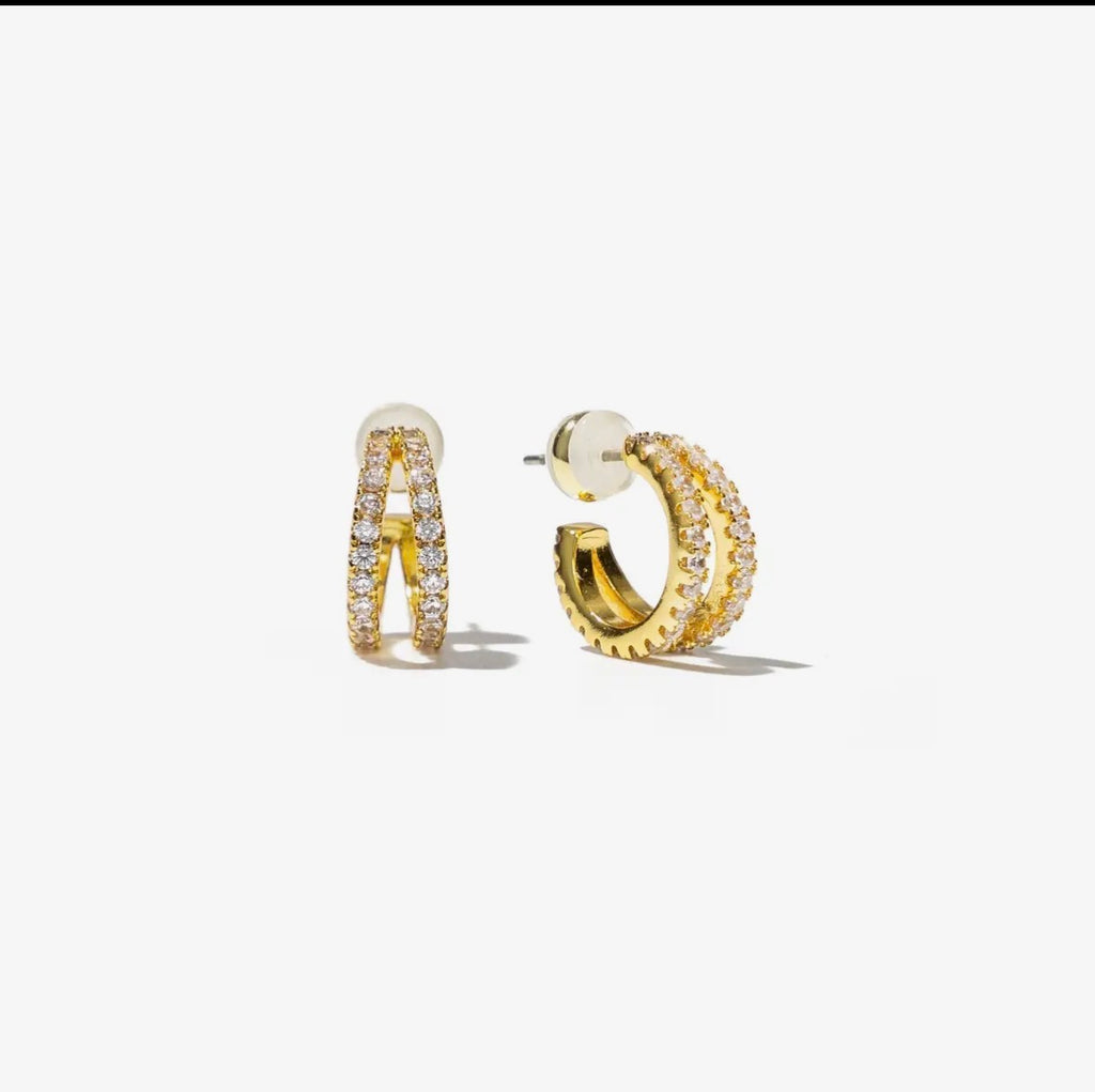 Gold hoop earrings with embedded stones on a white background