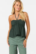 woman wearing green top on white background
