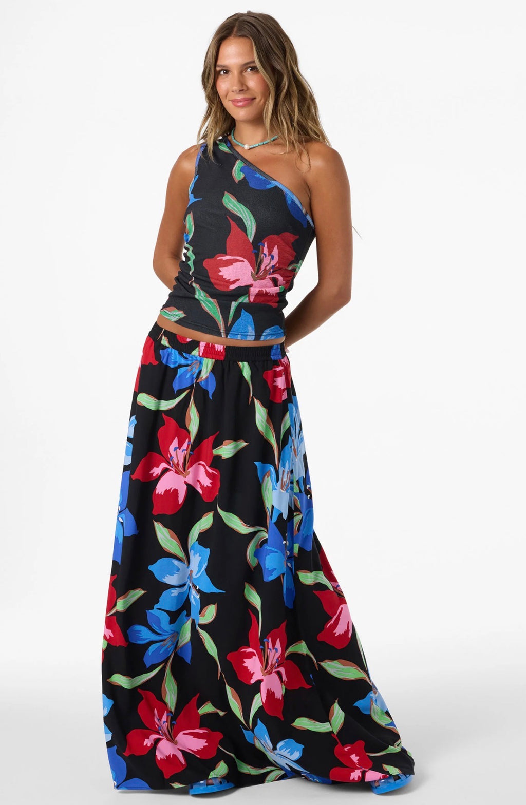 Woman wearing a black floral dress on a white background