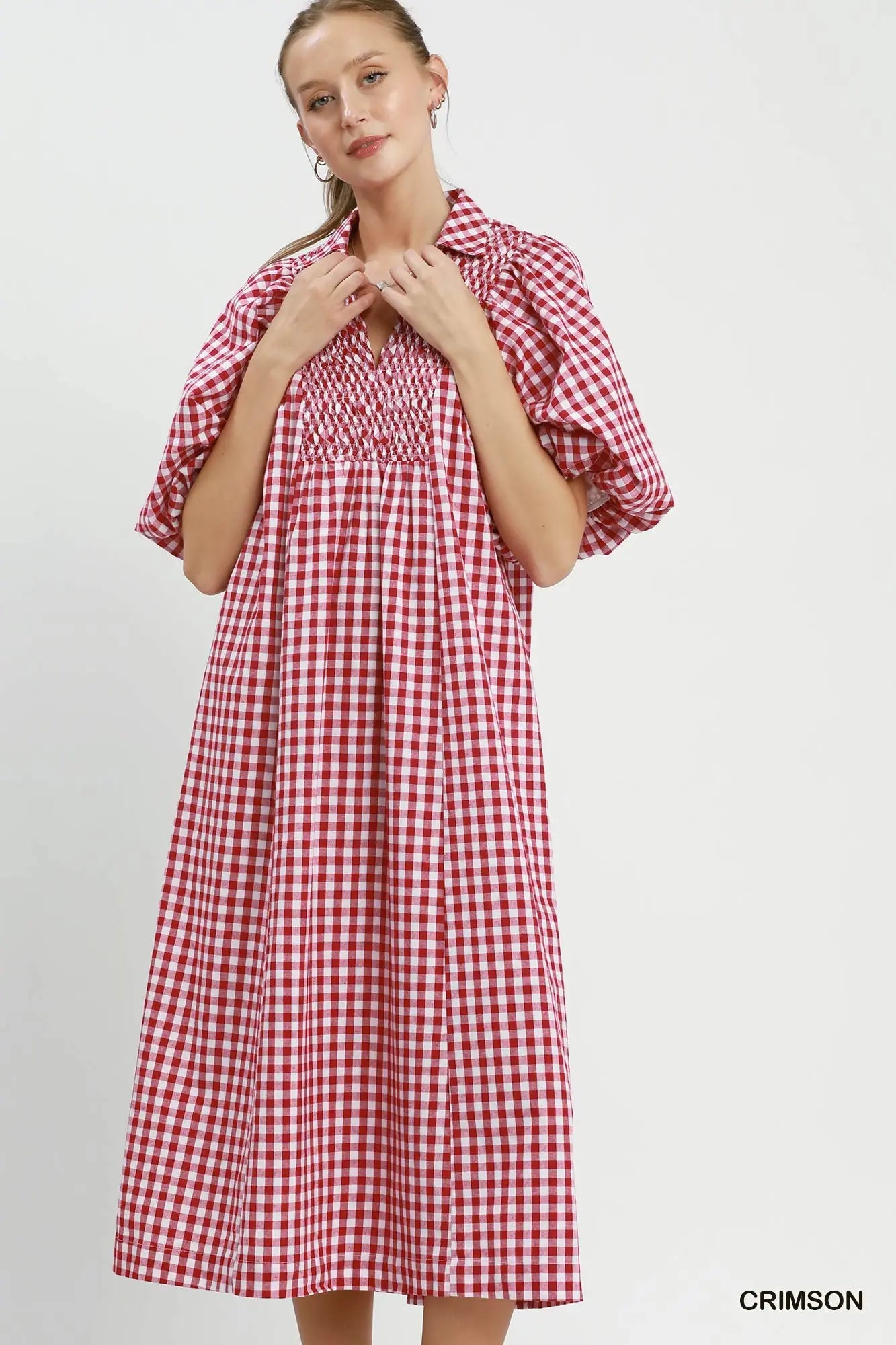 woman wearing red plaid dress
