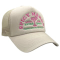 Beige cap with pink and green text and graphics on a white background