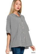 Woman wearing a black and white striped shirt on a white background