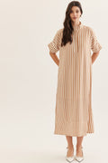 Woman wearing a striped dress on a white background