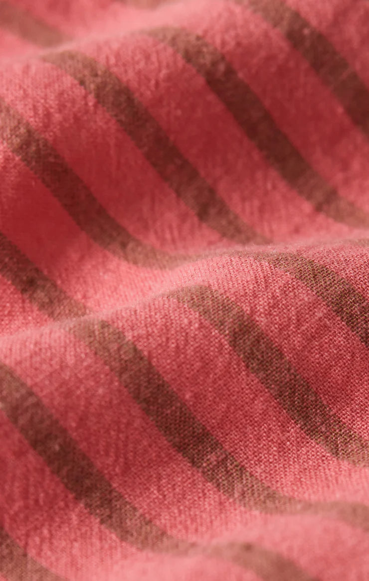 Close-up of pink fabric with brown stripes